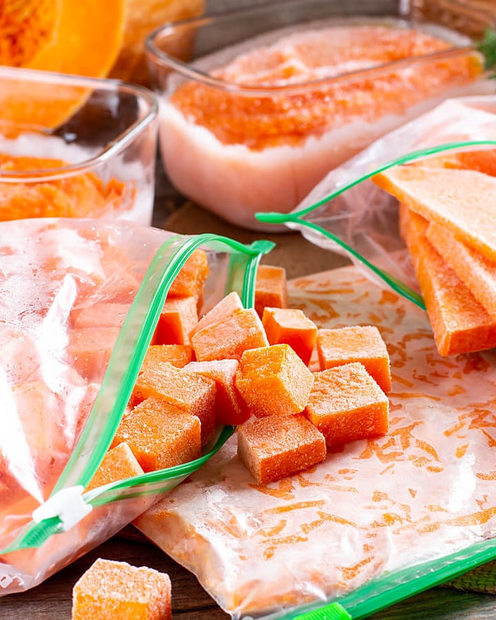 Freezing bags with frozen squash cut in form of cubes and slices.