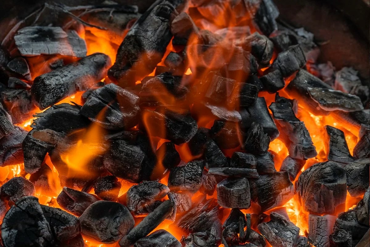 Close look of charcoal covered in fire.