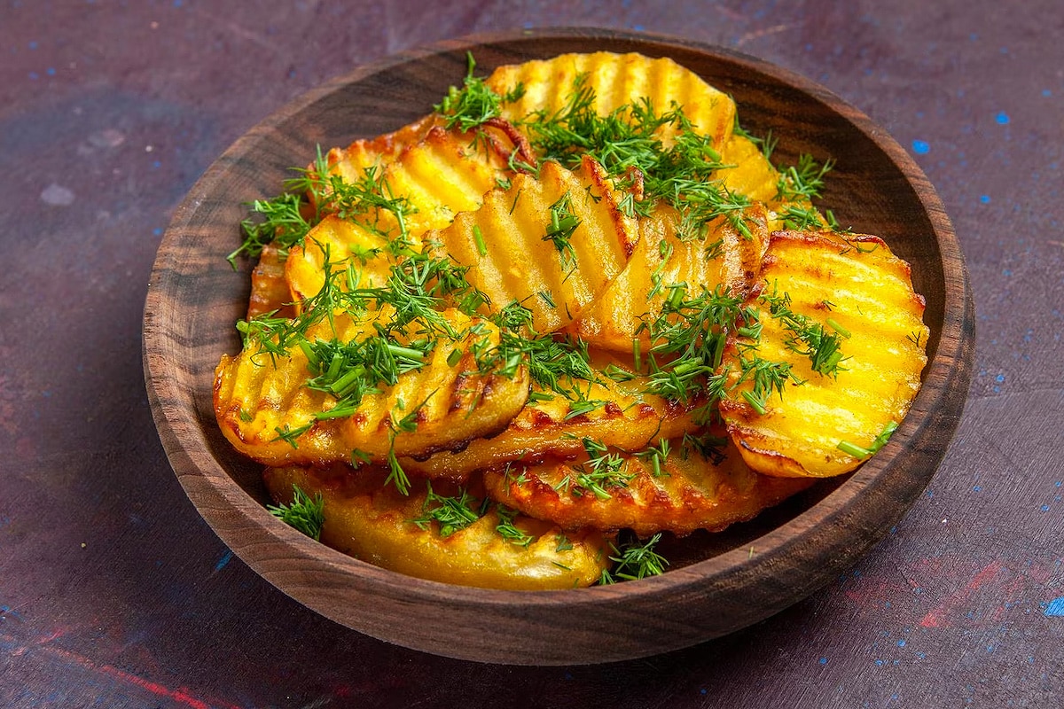 Roasted potatoes covered with chopped dill.