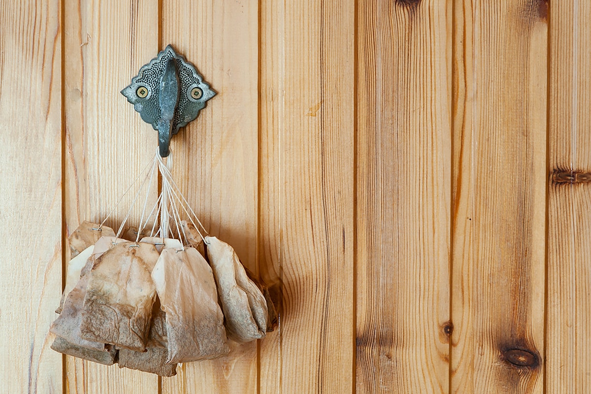 9 used tea bags hung in a hunger.