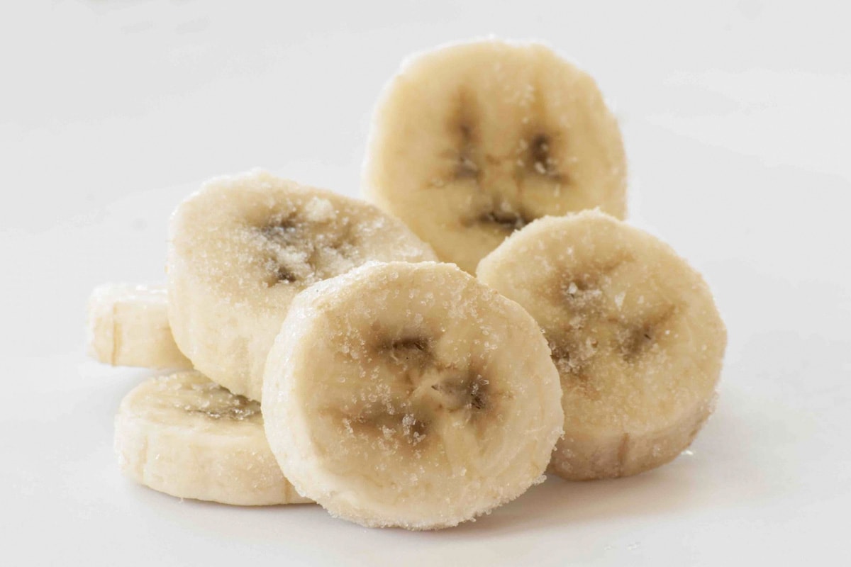 Close look of a few frozen banana slices.