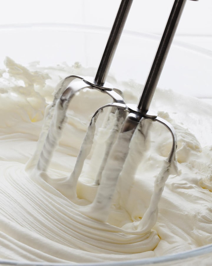 Close look of the process of making whipped cream from half and half.