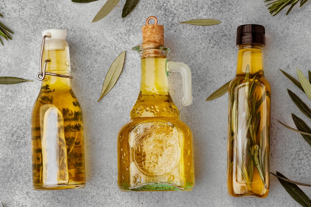 Top look of 3 different bottles with different types of oil.