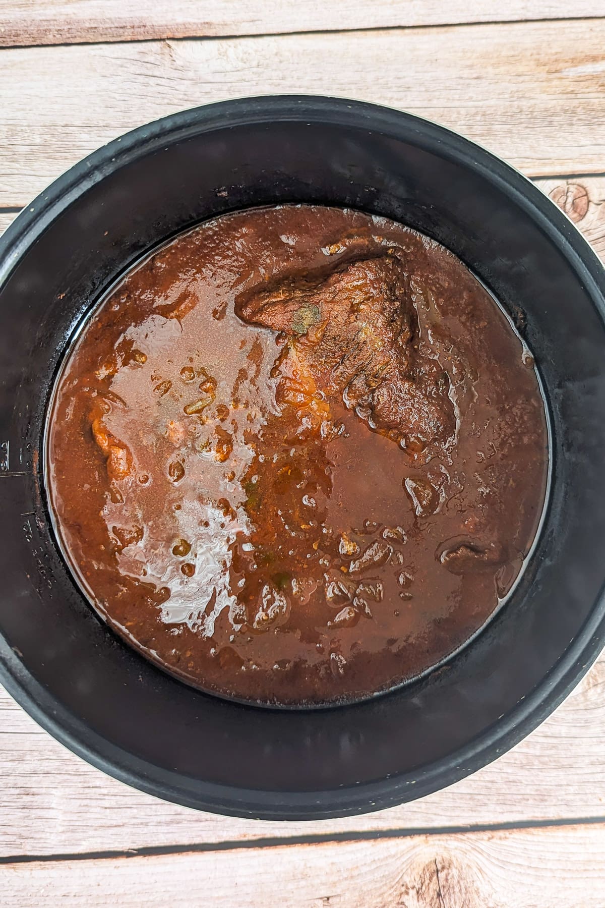 Cooked beef in slow cooker.