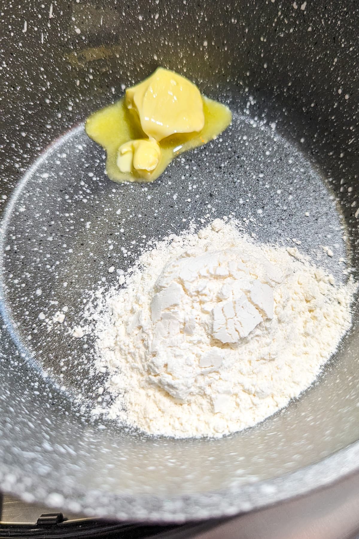 Close look of all-purpose flour and butter in a saucepan.