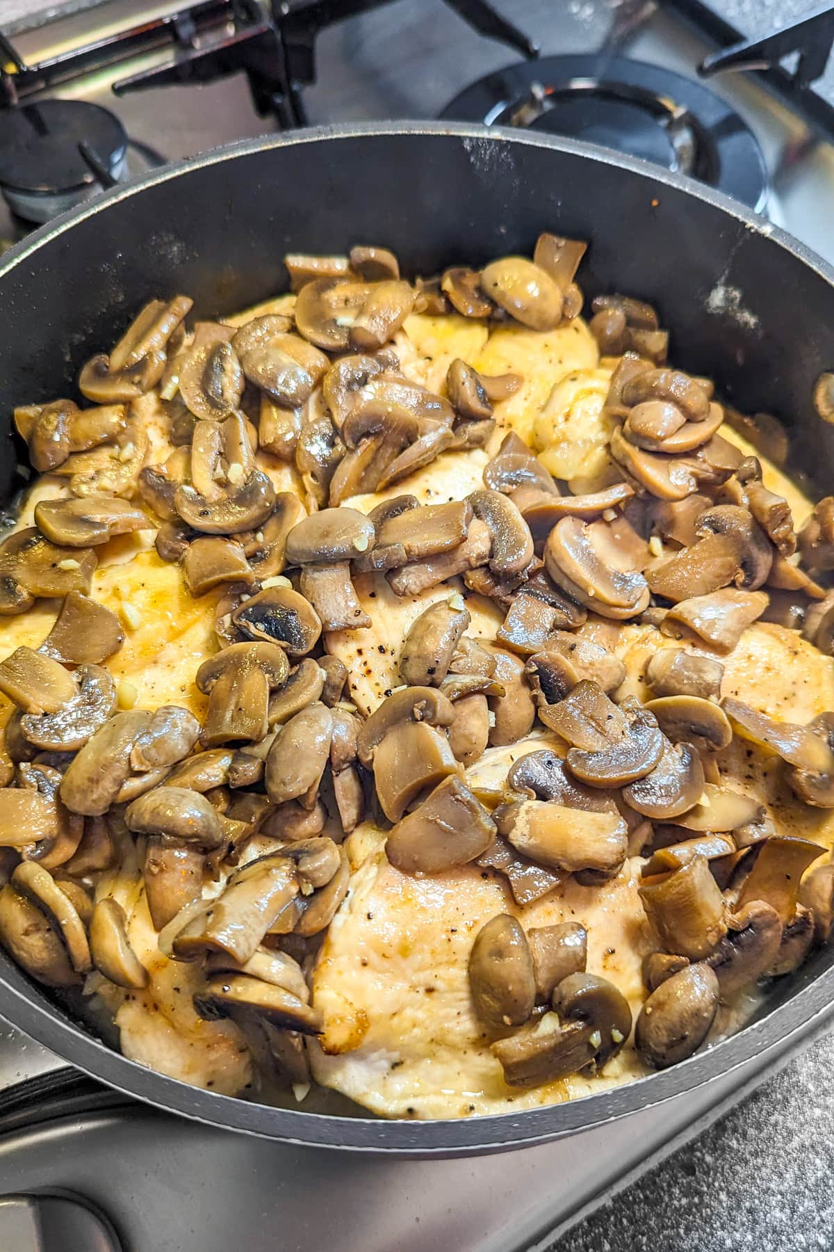Frying pan with creamy chicken marsala without mushrooms.