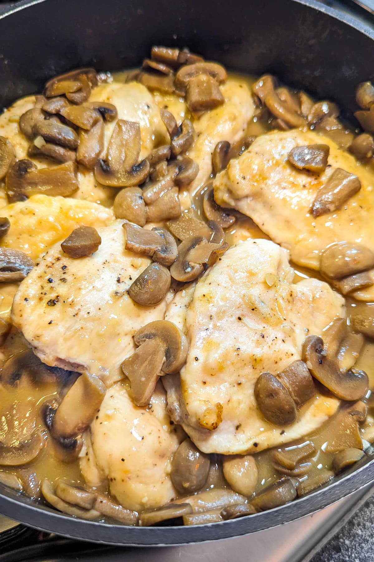 Frying pan with creamy chicken marsala without mushrooms.