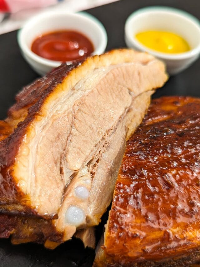 Close view of a juicy pork ribs cooked in a sweet and spicy sauce.