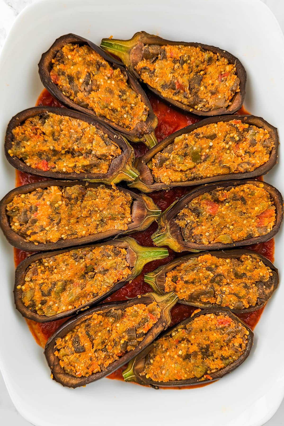 Eggplant boats stuffed with a mixture of eggplant, breadcrumbs, and parmesan cheese.
