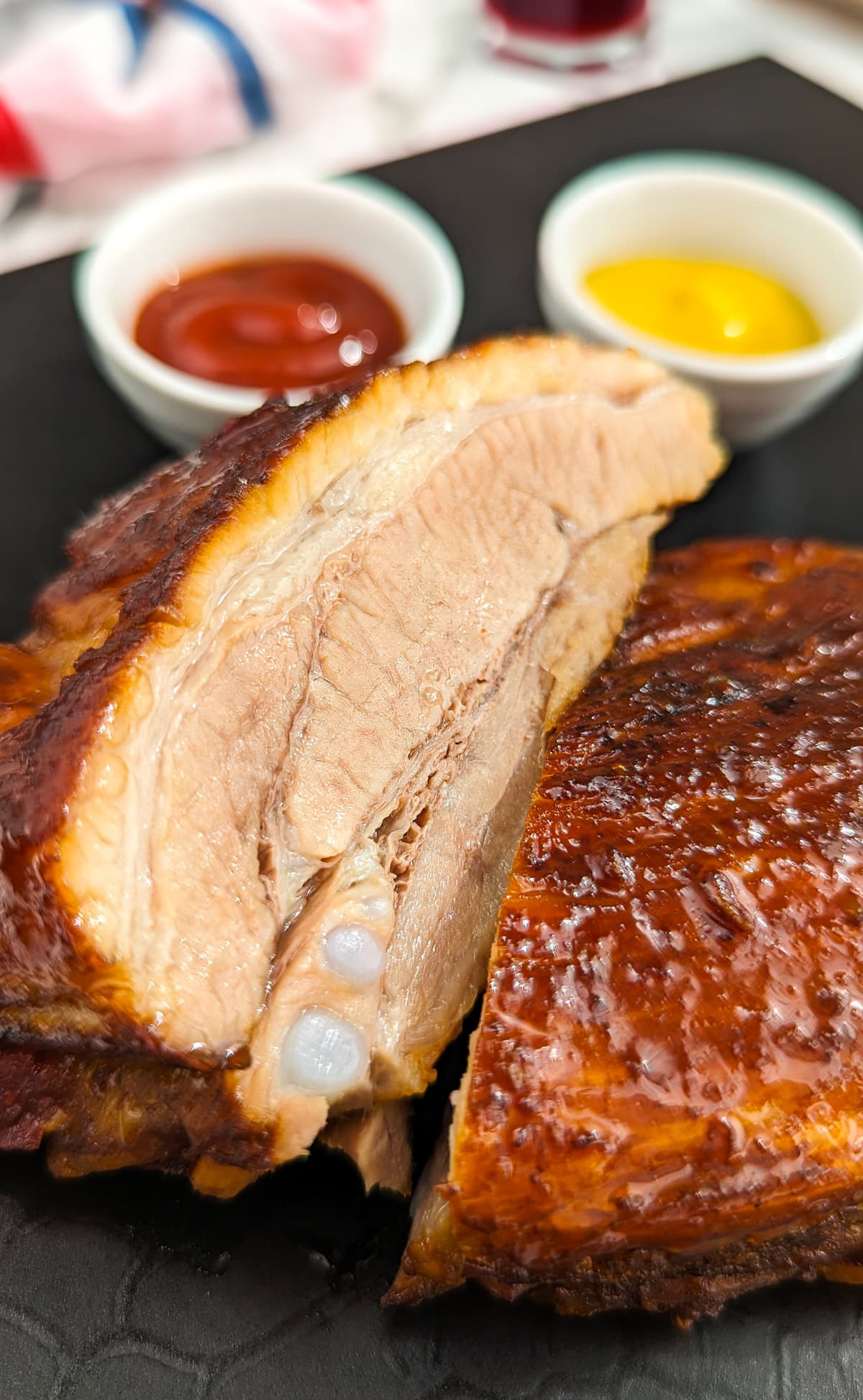 Close view of a juicy pork ribs cooked in a sweet and spicy sauce.