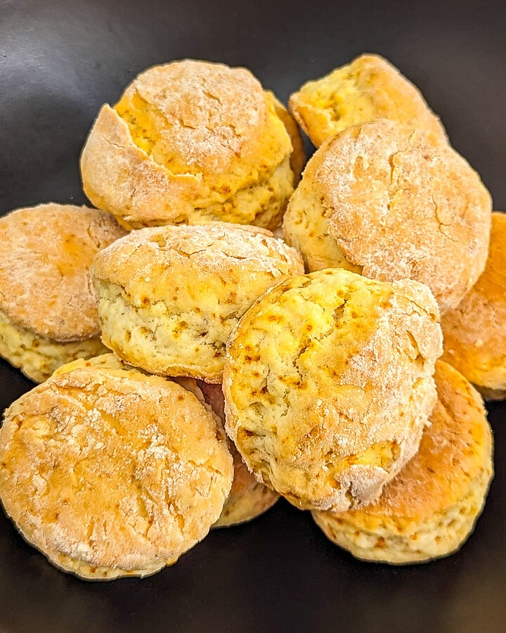 Black plate full with golden scones made from only 2 ingredients.