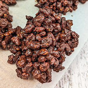 Close look of chocolate crackles on a parchment paper.