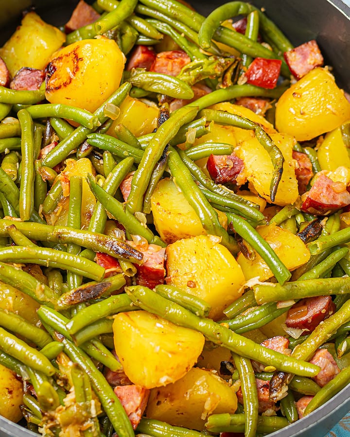 Close-up of the skillet with the finished green bean, potato, and kielbasa dish.